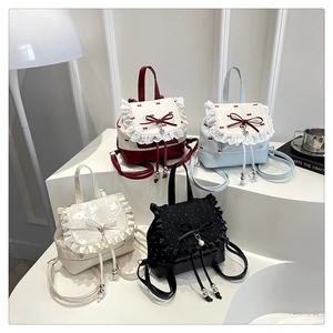 Group shot of colorful bow travel backpacks with lace trim and heart prints