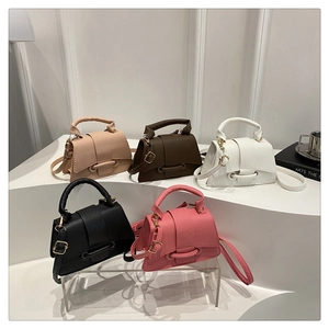 Collection of five colorful pebble leather mini bags with unique ring buckle and straps