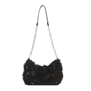 Elegant black evening clutch featuring 3D mesh rose floral design with silver chain strap