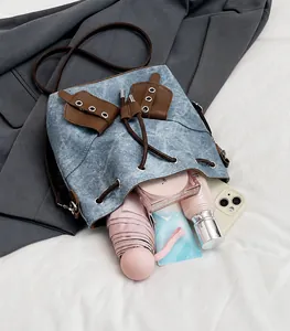 Top view of bucket bag interior showing spacious capacity for phone and cosmetics