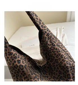 Macro shot of durable leopard print canvas fabric and textured finish on a large tote bag