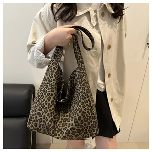 Close-up of leopard print canvas tote bag showing high-capacity design and soft texture