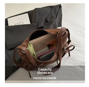 Top view of brown retro shoulder bag showing large capacity for umbrella and notebook