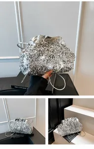 Detail of silver sequin cloud bag showing metallic shimmer texture and pleated top design