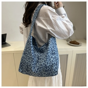 Blue leopard print tote bag lifestyle shot showing the spacious casual shoulder design