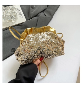 Detailed view of champagne gold sequin cloud bag with elegant pleated metallic leather top