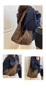 Close-up of leopard print canvas tote bag featuring large capacity and soft hobo style