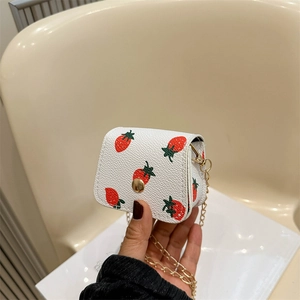 Mini white leather coin purse with red strawberry print and gold chain strap