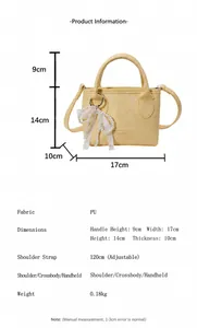 Detail view of yellow PU leather mini bag showing pearl charm and dimensions