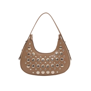 Brown crescent shoulder bag with metallic stud details and adjustable leather strap