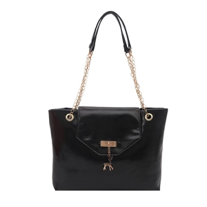 Glossy black leather shoulder bag with gold chain strap and deer pendant on white backdrop