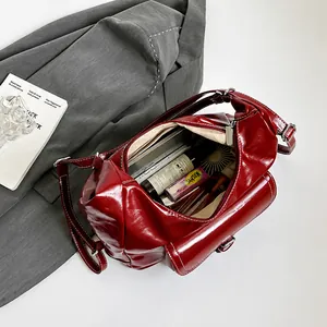 Interior view of the burgundy tote bag showing spacious storage for daily essentials