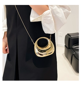 Glossy gold crescent hard shell evening bag with metal handle and chain strap