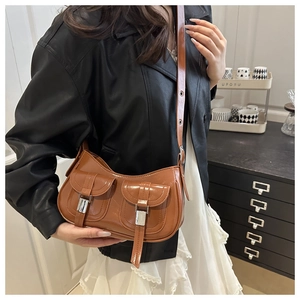 Chic caramel brown underarm bag featuring double pockets and silver metal buckles