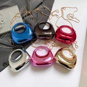 Chic crescent acrylic evening clutches in various metallic colors with gold chain straps