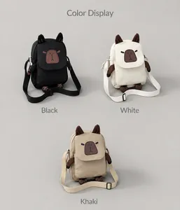 Three colors of capybara shoulder bags with 3D ears and paws on a wooden table