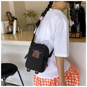Cute capybara-themed crossbody bag with detailed animal embroidery and small paws