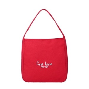 Minimalist red canvas tote bag with white C'est lavie lettering for daily commute