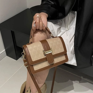 Fashionable brown and beige crossbody bag with geometric embossed pattern and gold buckle