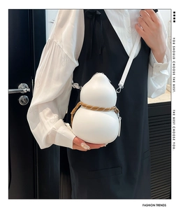 Unique gourd-shaped white leather crossbody bag with brown woven rope detail on model