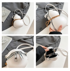 Detail view of white gourd-shaped crossbody bag with braided rope and dual metal zippers