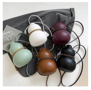 Detailed view of gourd-shaped crossbody bags in five colors with woven decorative ropes