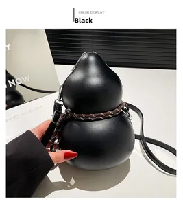 Detail of creative gourd-shaped crossbody bag with decorative braided rope and matte finish