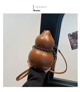 Detail of brown gourd-shaped crossbody bag with decorative rope and silver hardware