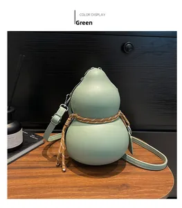 Detailed view of gourd-shaped green leather crossbody bag with braided rope knot detail