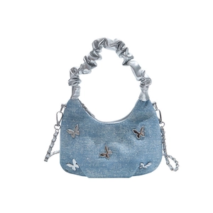 Blue denim Y2K hobo bag with silver butterfly charms and ruffled chain strap
