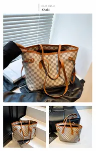 Dettaglio della borsa shopper kaki con motivo monogramma e finiture in pelle marrone