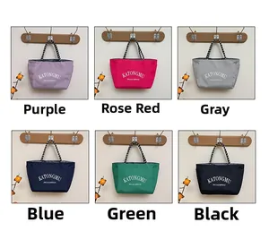 Waterproof nylon tote bags shown in six colors with decorative rope handles