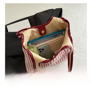 Detail view of large canvas tote bag showing interior capacity with a magnetic closure
