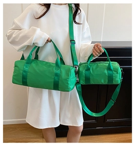 Detailed comparison of two green nylon crossbody bags in large and small sizes