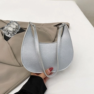 Silver metallic dumpling bag with litchi pattern and minimalist half-moon design