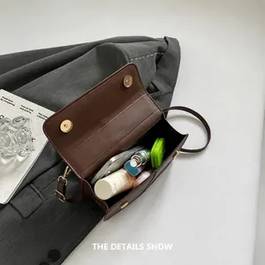 Interior view of small vintage crossbody bag showing spacious capacity for daily essentials