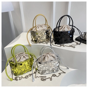 Detail of sequin bucket bags in gold black green and silver with drawstring inner