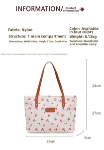 Detail view of cherry print tote bag with brown straps and dimensions 29x27x9cm