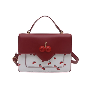 Bolso bandolera rojo y blanco con estampados de cerezas y cierre de cereza brillante