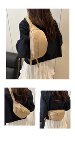 Detail view of khaki crossbody waist bag featuring woven rope zipper pulls on nylon fabric