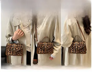 Three-way view of leopard print handbag showing handheld, shoulder and crossbody styles