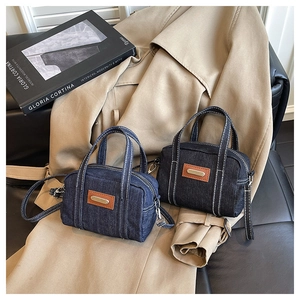 Classic denim mini boston bags in navy and black with contrast stitching and long straps