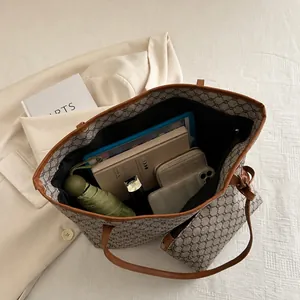 Top view of large tote bag interior showing ample space for tablets and daily essentials