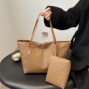 Macro shot of brown geometric patterned tote bag set with matching zipper pouch