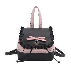 Zaino rosa con motivi di fiocchi neri e design elegante con bordi a balze
