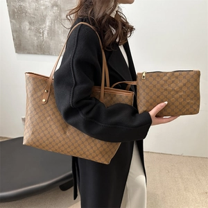 Brown vintage monogram tote bag set including a large shoulder bag and small zipper pouch