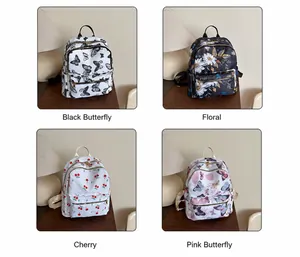 Détail de sacs à dos légers en tissu Oxford avec motifs de cerises et fleurs variés