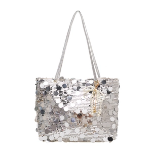 Sparkly silver sequin tote bag with a white pearl bow charm for a trendy look