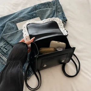 Detail view of lace trim leather backpack interior showing daily storage capacity