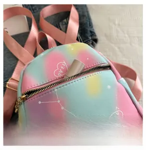 Detail of nylon mini backpack featuring romantic tie-dye gradient and love heart prints